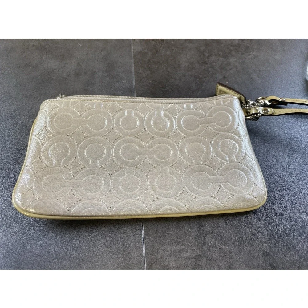 Coach Signature C Metallic Beige Wristlet w/ Purple Satin Interior